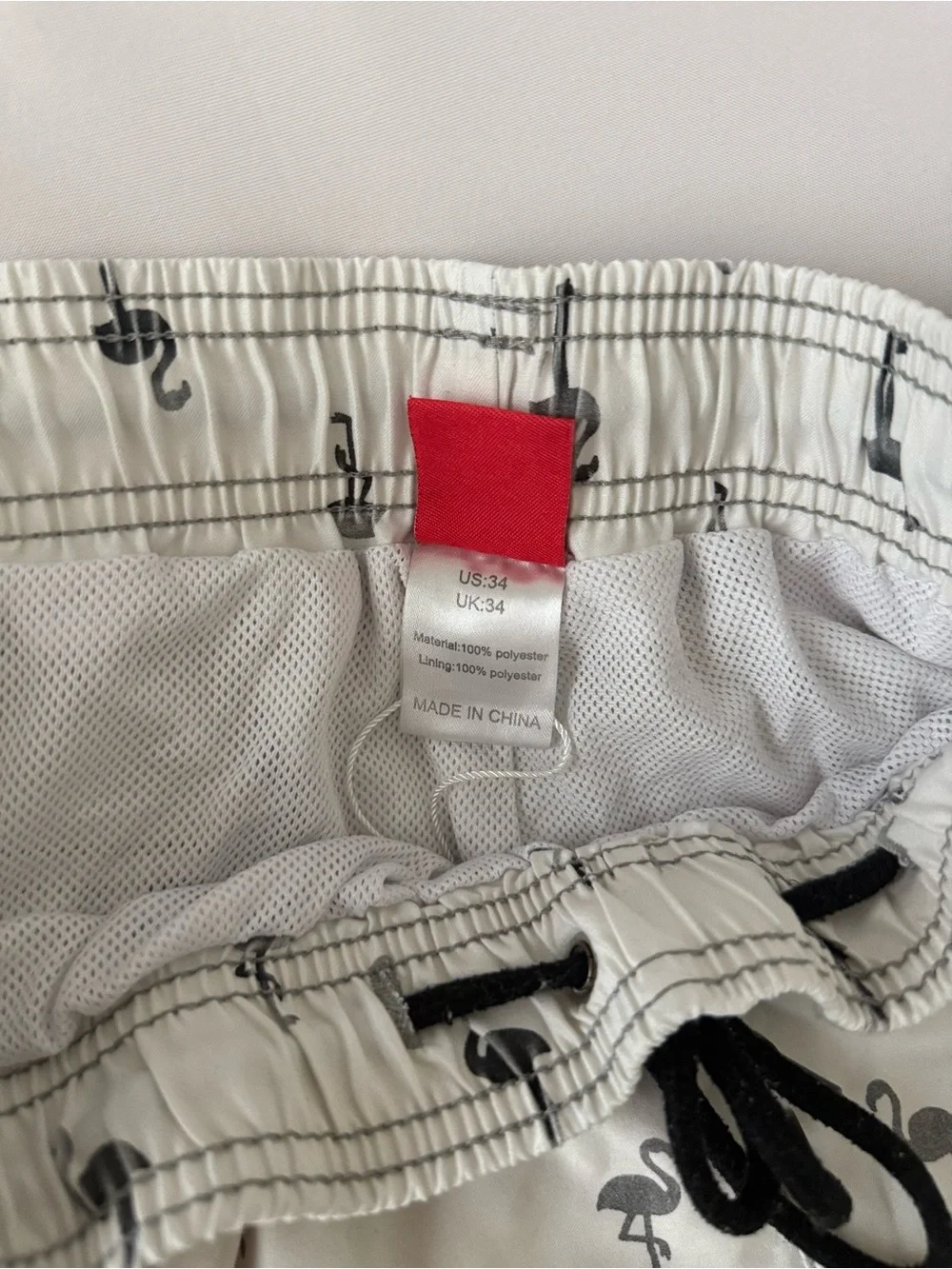White mens Swim Trunks with Black Flamingo Print